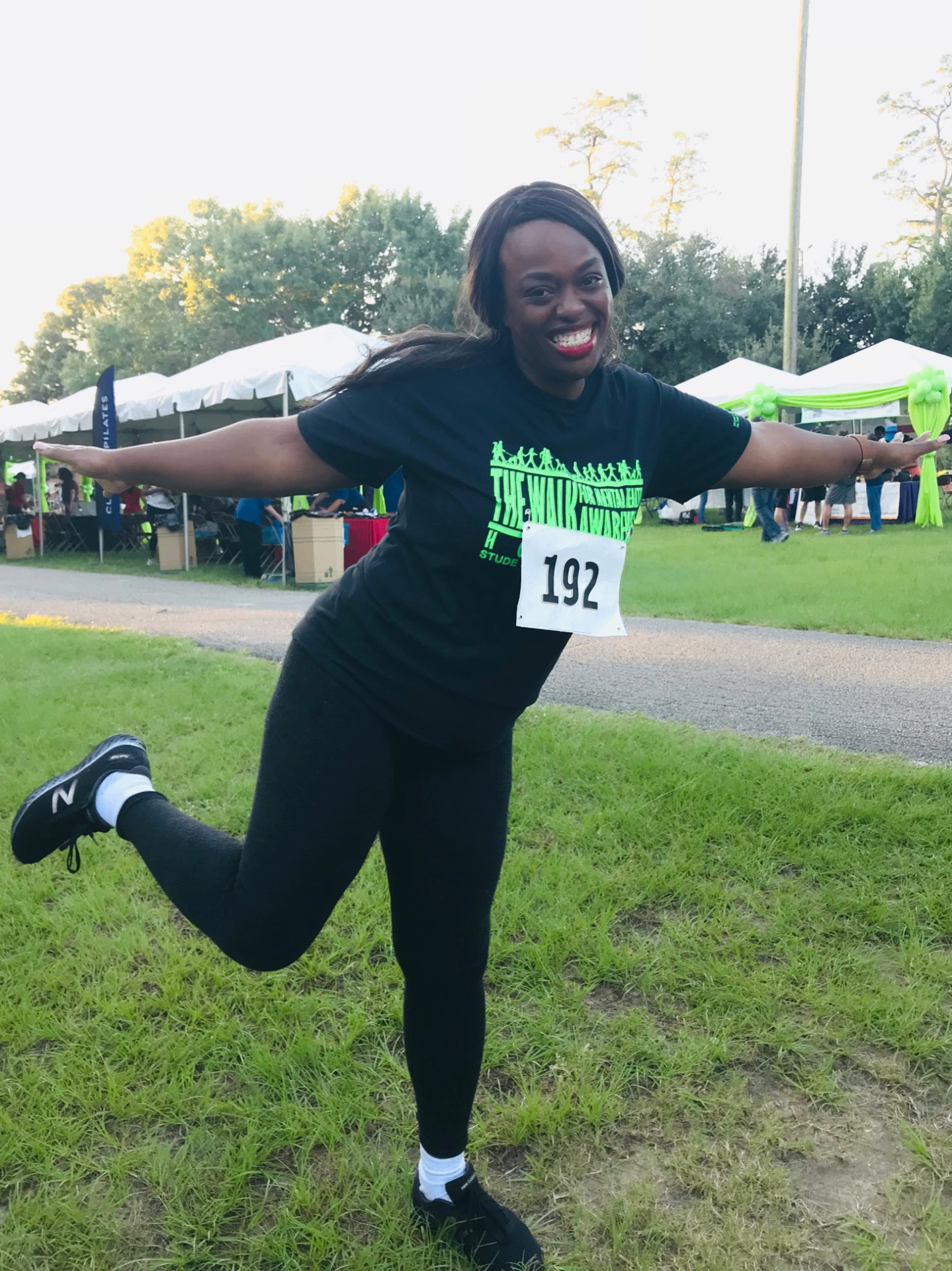Community member posing at a wellness walk event